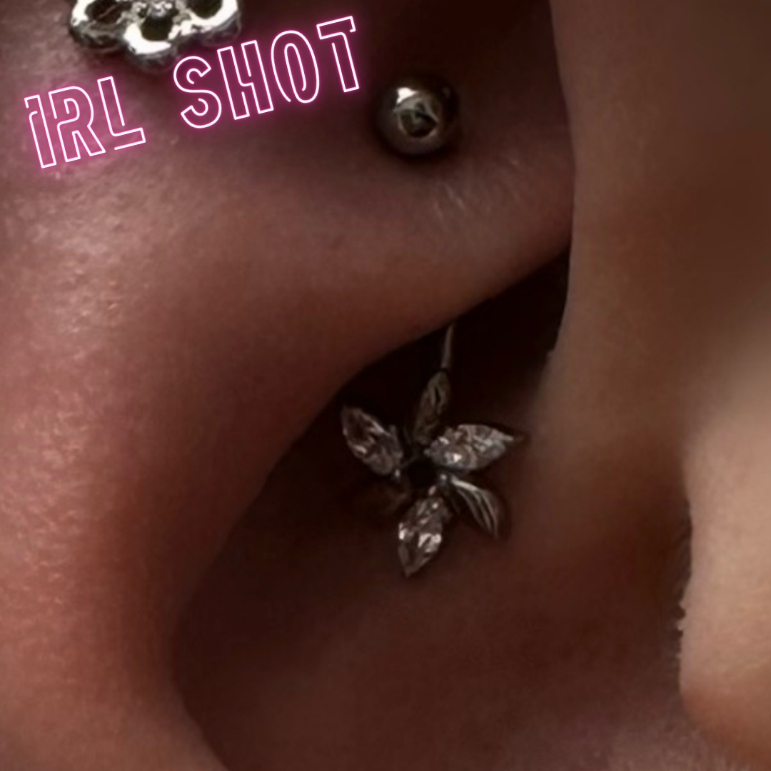 Eyebrow/rook barbell with a marquise flower
