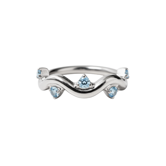 Ring with a swirl and blue gems