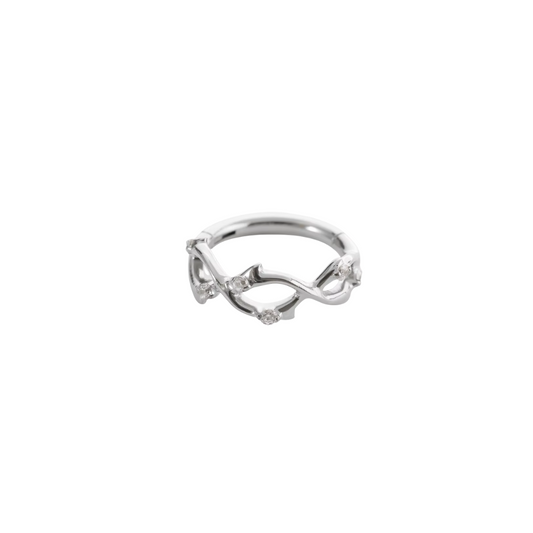 Ring with swirls and clear gems