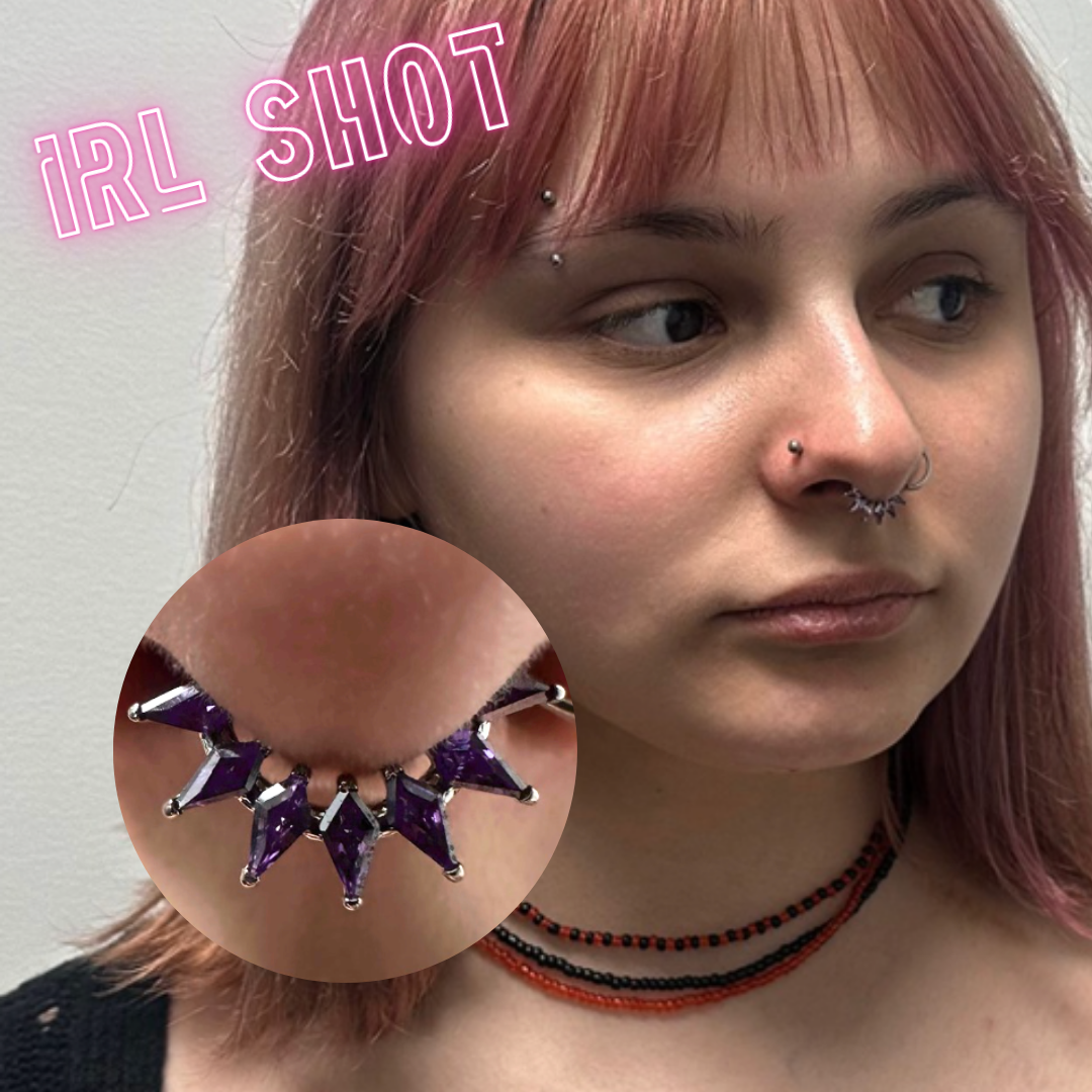 Ring with purple marquise gems