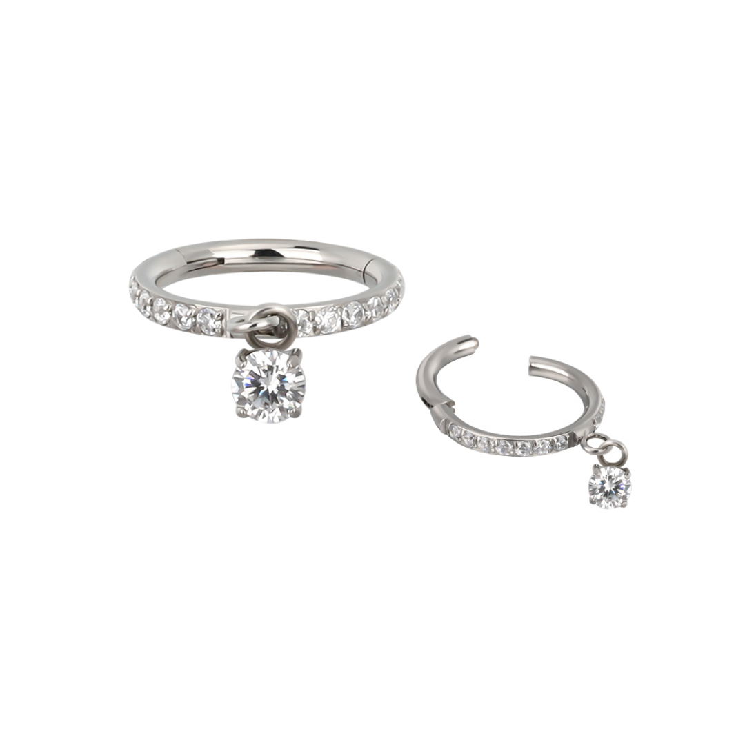 Ring with gems and a charm