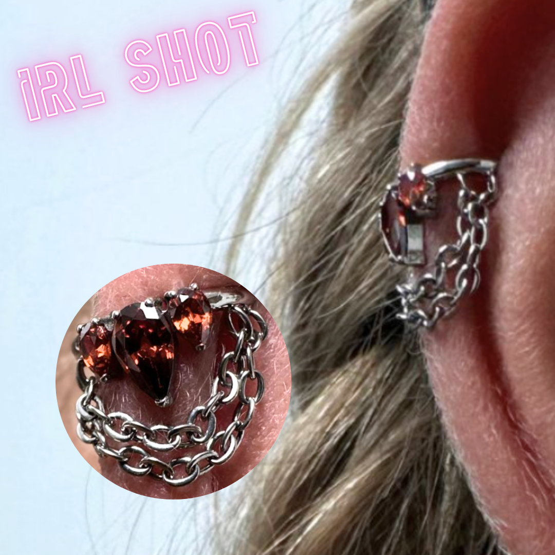 Ring with red side gems and chains