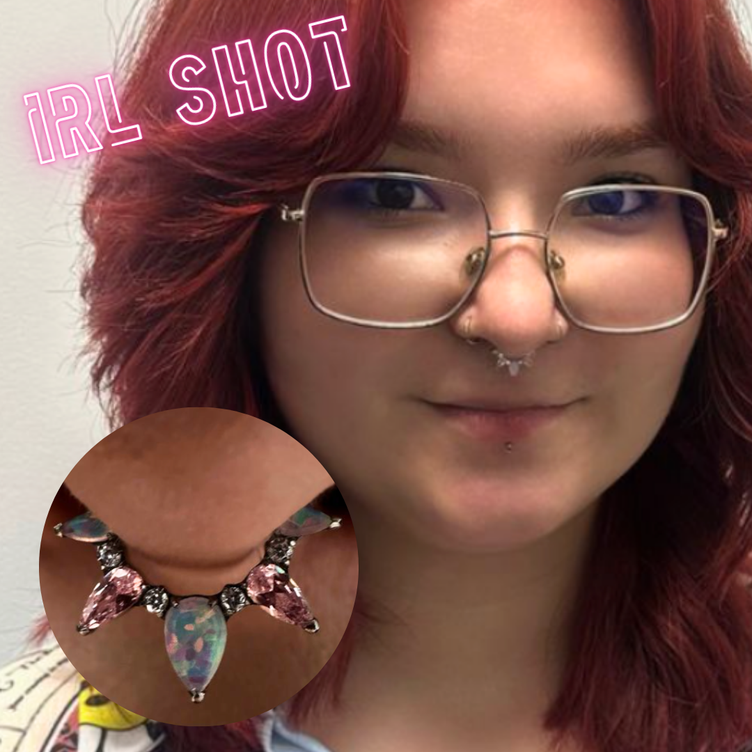 Ring with pink gems and opals